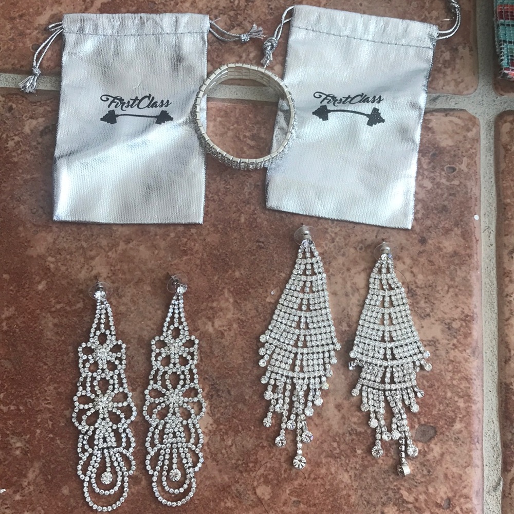 Two pairs of competition earrings and 1 bracelet.